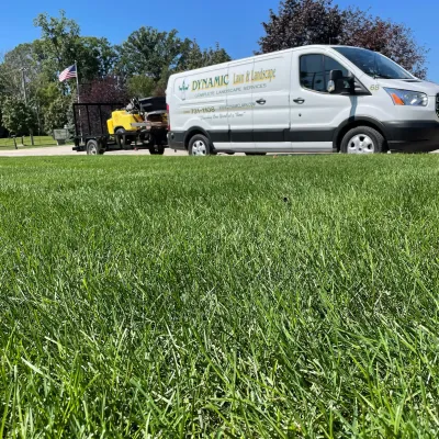 green grass and company truck