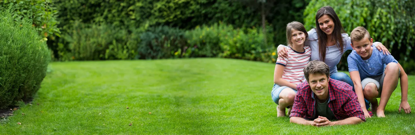 family enjoying being outside in back yard