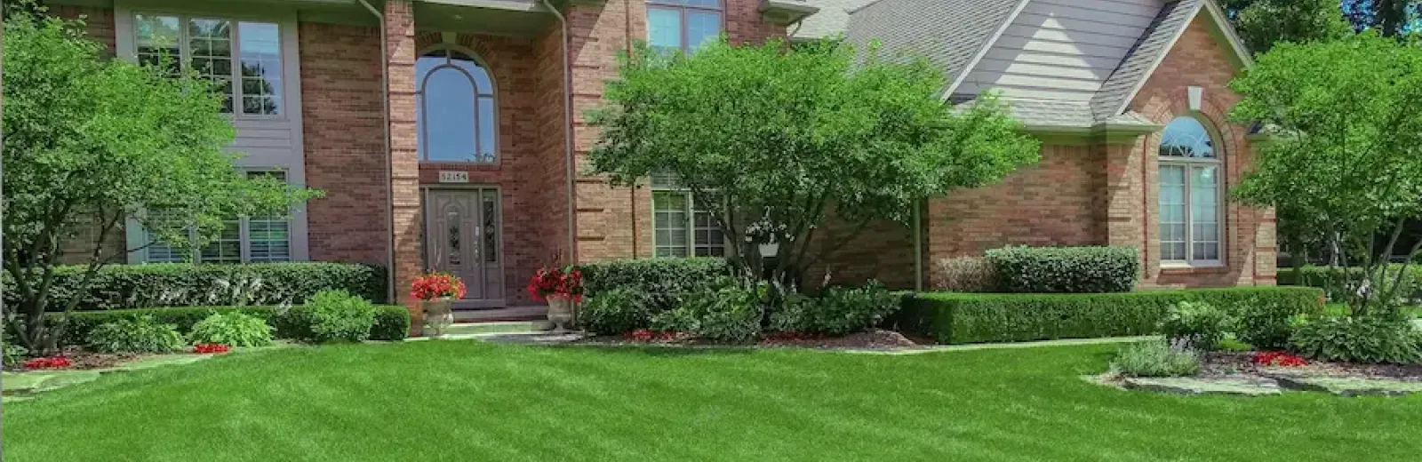 home with nice landscaping around home